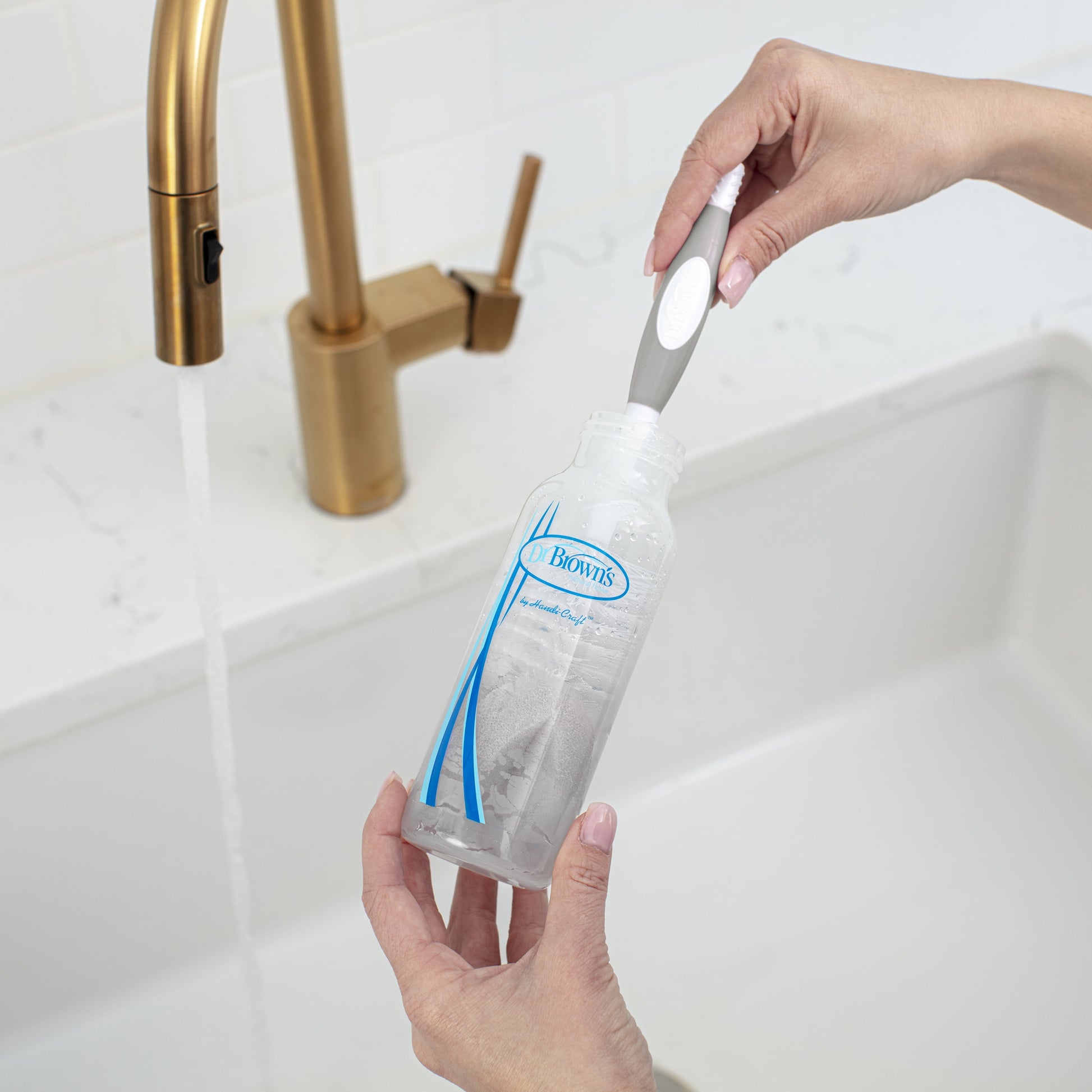 Dr. Brown's 4-in-1 Baby Bottle Cleaning Brush-Suction Stand, Sponge Brush & Nipple Cleaner (Gray)